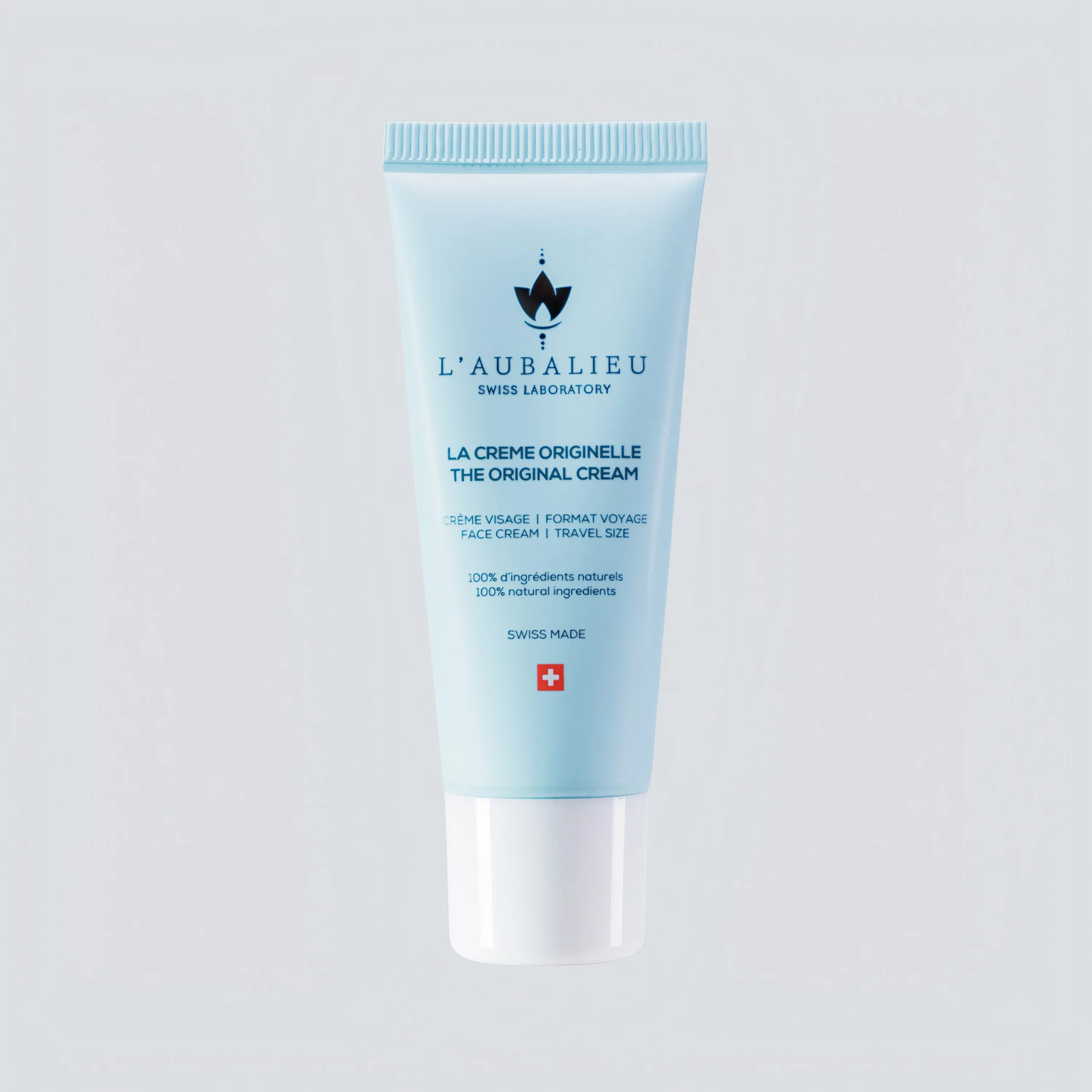 Tube de La Crème Originelle de L'aubalieu avec la mention '100% ingrédients naturels', garantie de notre qualité suisse