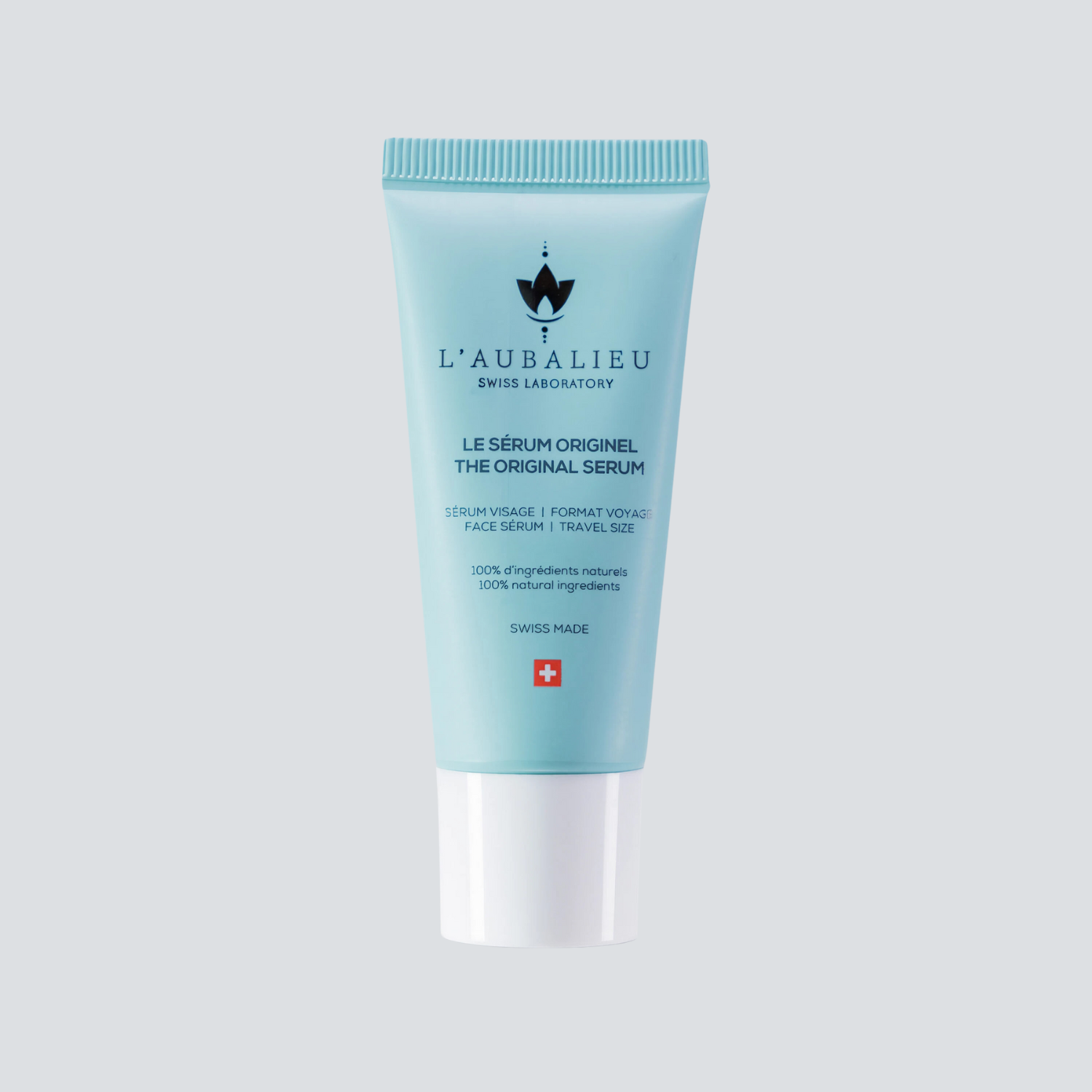 Tube de Le Sérum Originel L'AUBALIEU, symbole de soin phytocosmétique suisse